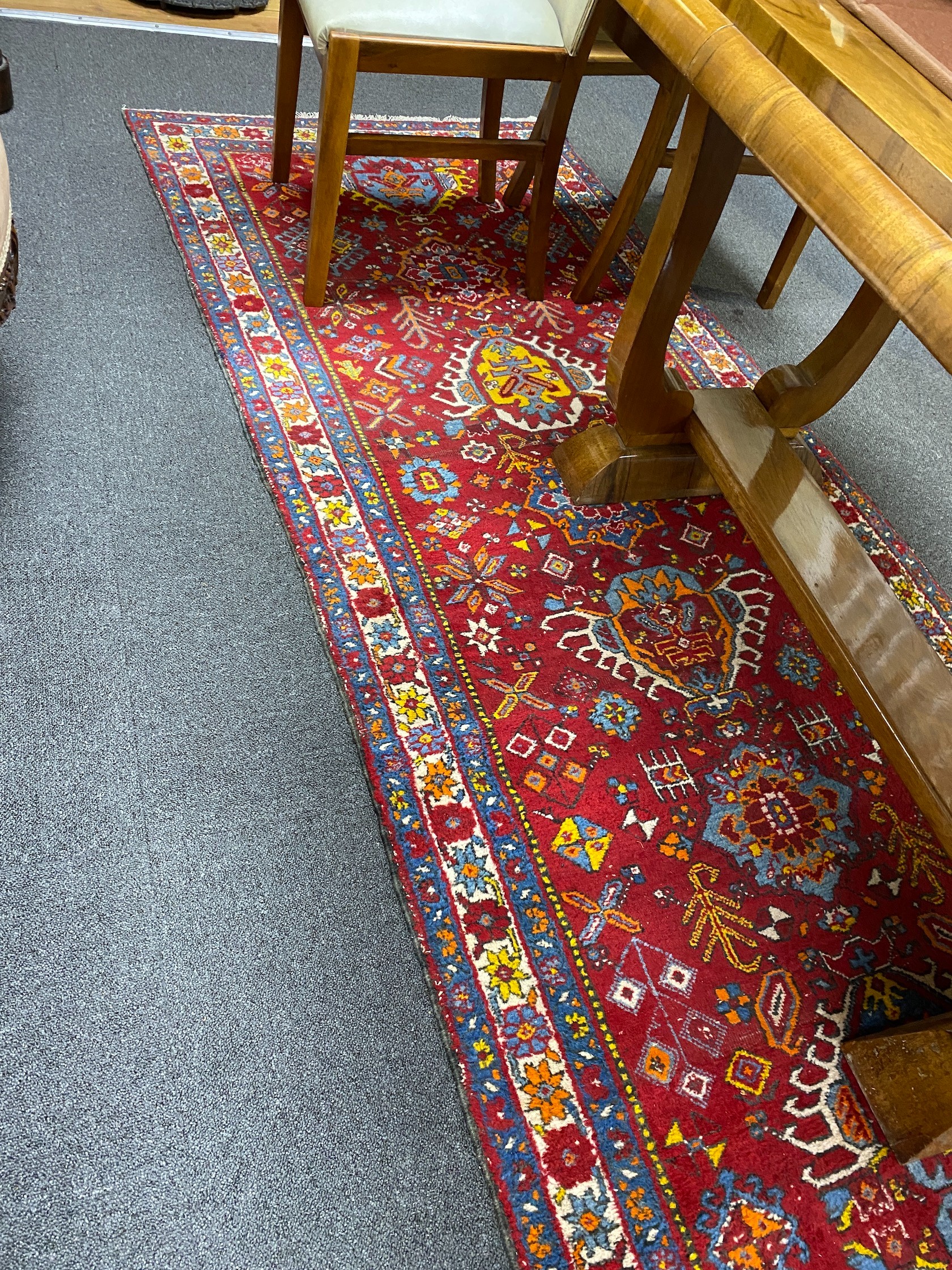 A North West Persian red ground runner, 426 x 100cm